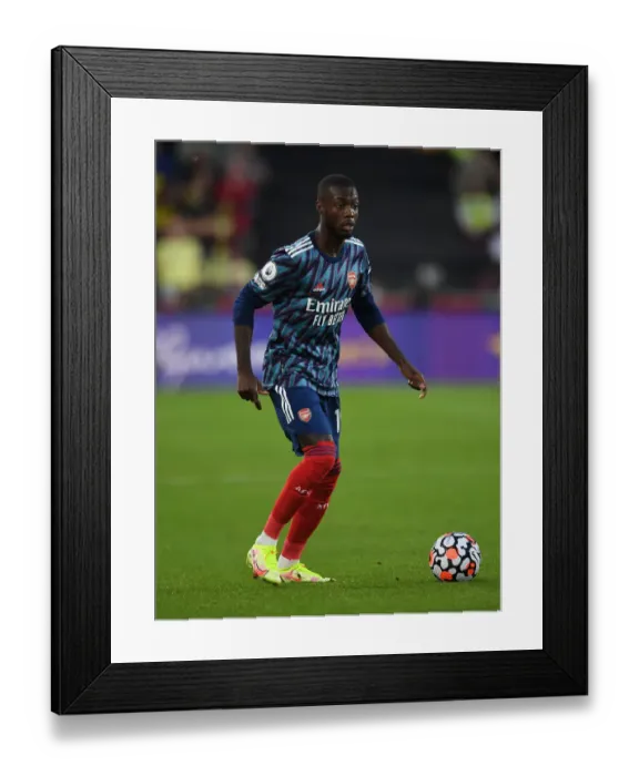 Framed Print : Nicolas Pepe in Action: Brentford vs Arsenal, 2021-22 Premier League Framed Print : Nicolas Pepe in Action: Brentford vs Arsenal, 2021-22 Premier League
