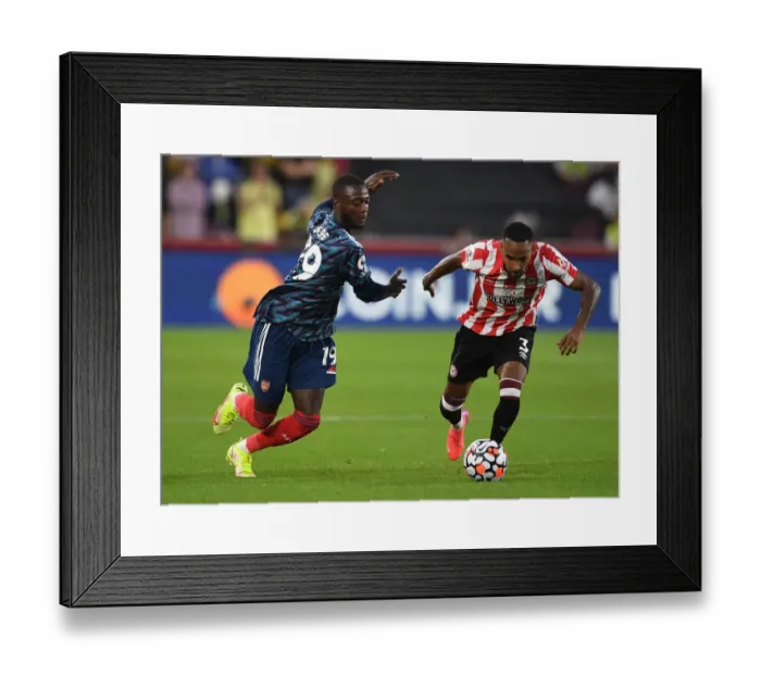 Framed Print : Pepe vs Henry: A Premier League Showdown at Brentford Community Stadium Framed Print : Pepe vs Henry: A Premier League Showdown at Brentford Community Stadium