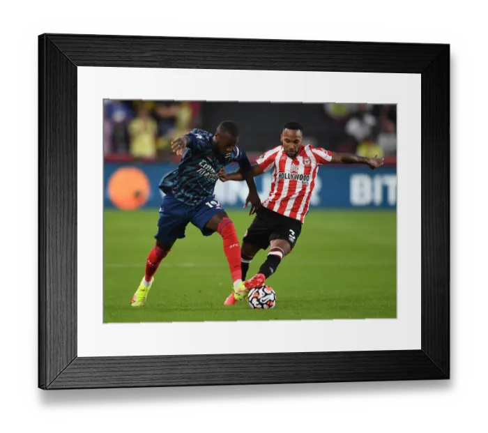 Framed Print : Pepe vs Henry: A Premier League Showdown - Brentford vs Arsenal, 2021-22