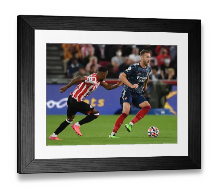 Framed Print : Brentford vs Arsenal: Calum Chambers Clashes with Rico Henry in Premier League Showdown Framed Print : Brentford vs Arsenal: Calum Chambers Clashes with Rico Henry in Premier League Showdown