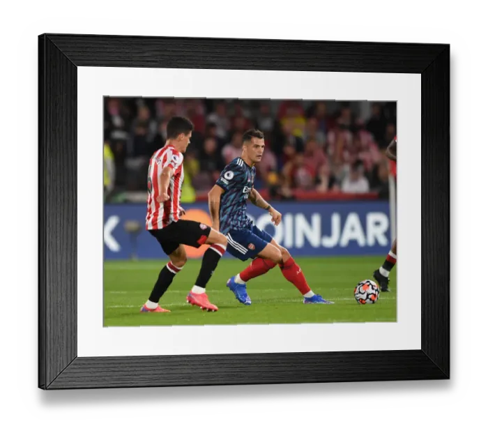 Framed Print : Xhaka Under Pressure: Brentford vs. Arsenal, Premier League 2021-22