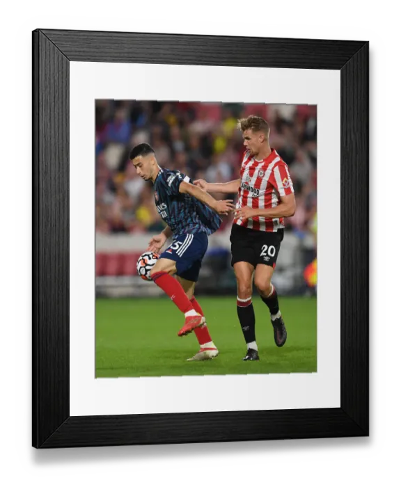 Framed Print : Brentford vs Arsenal: Gabriel Martinelli Faces Off Against Kristoffer Ajer in Premier League Clash Framed Print : Brentford vs Arsenal: Gabriel Martinelli Faces Off Against Kristoffer Ajer in Premier League Clash