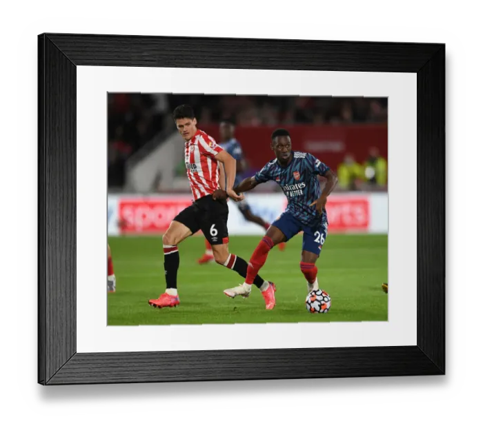 Framed Print : Brentford vs Arsenal: Intense Clash in Premier League - Flo Balogun vs Christian Norgaard
