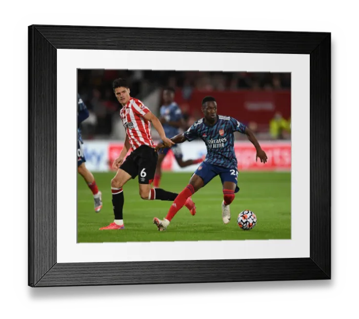 Framed Print : Intense Premier League Clash: Flo Balogun vs Christian Norgaard - Arsenal's Battle at Brentford Community Stadium (2021-22) Framed Print : Intense Premier League Clash: Flo Balogun vs Christian Norgaard - Arsenal's Battle at Brentford Community Stadium (2021-22)