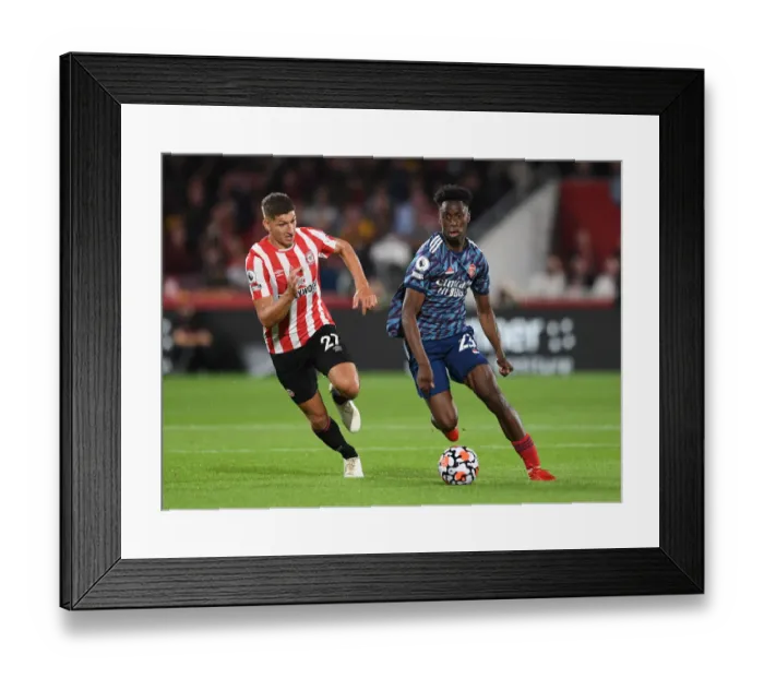Framed Print : Clash of the Midfielders: Lokonga vs Janelt - Brentford vs Arsenal Premier League Showdown