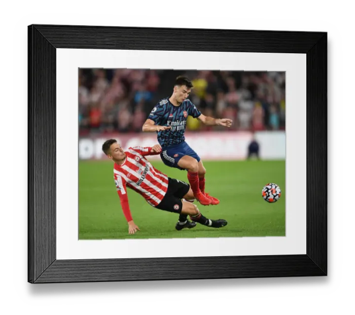 Framed Print : Brentford vs Arsenal: Tierney Faces Off Against Canos in Premier League Clash Framed Print : Brentford vs Arsenal: Tierney Faces Off Against Canos in Premier League Clash
