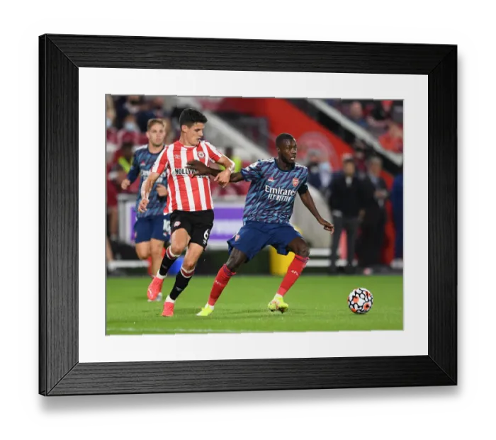 Framed Print : Pepe vs Canos: Battle at Brentford Community Stadium - Arsenal vs Brentford, Premier League 2021-22