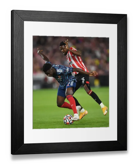 Framed Print : Bukayo Saka vs. Frank Onyeka: Clash at Brentford Community Stadium - Arsenal vs. Brentford, Premier League 2021-22 Framed Print : Bukayo Saka vs. Frank Onyeka: Clash at Brentford Community Stadium - Arsenal vs. Brentford, Premier League 2021-22
