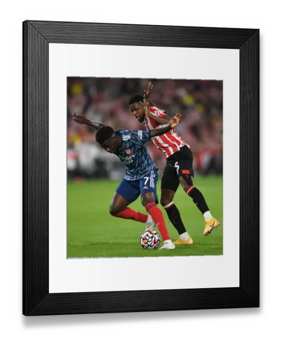 Framed Print : Saka vs. Onyeka: A Premier League Showdown - Arsenal vs. Brentford Framed Print : Saka vs. Onyeka: A Premier League Showdown - Arsenal vs. Brentford