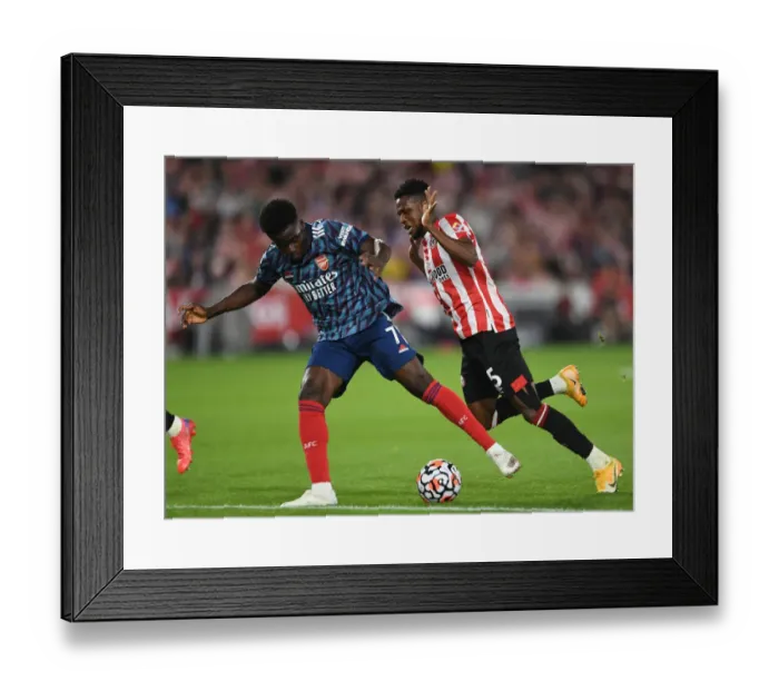 Framed Print : Bukayo Saka's Stellar Performance: Arsenal Triumphs Over Brentford in 2021-22 Premier League