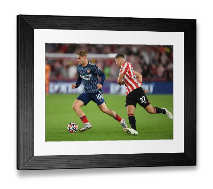 Framed Print : Emile Smith Rowe vs. Vitaly Janelt: A Premier League Battle - Arsenal vs. Brentford (2021-22)