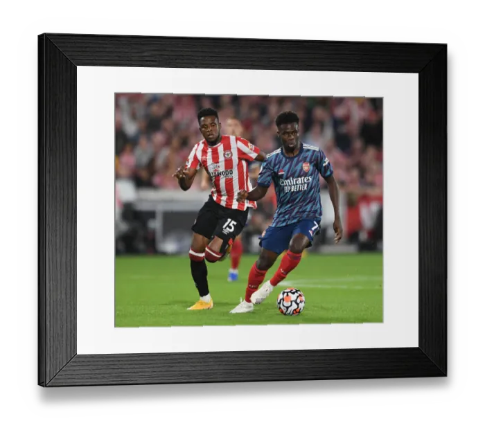 Framed Print : Bukayo Saka's Brilliance: Arsenal's Commanding Win over Brentford in the 2021-22 Premier League