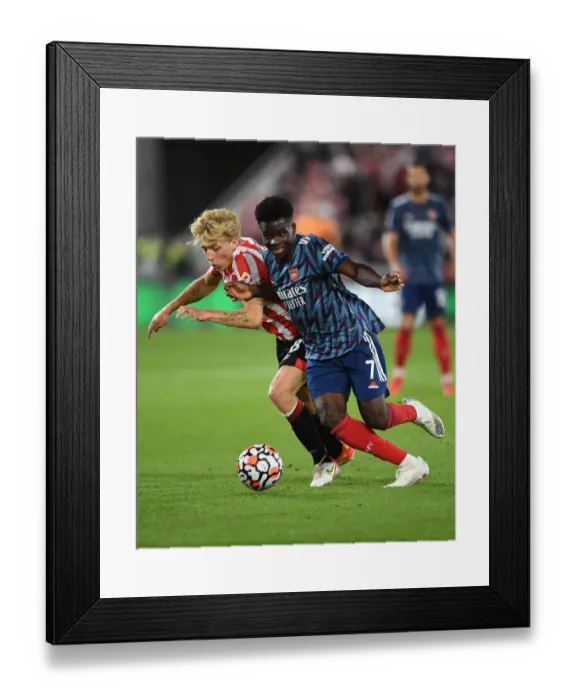 Framed Print : Bukayo Saka in Action: Arsenal vs. Brentford, Premier League 2021-22 Framed Print : Bukayo Saka in Action: Arsenal vs. Brentford, Premier League 2021-22
