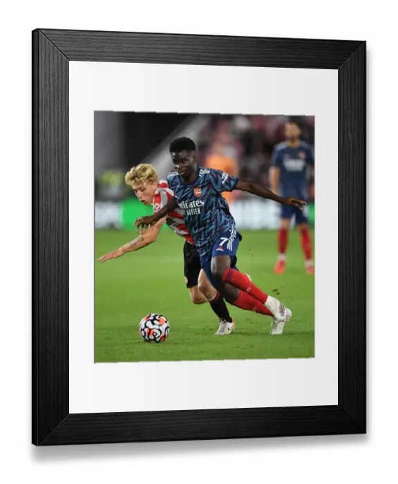 Framed Print : Arsenal's Bukayo Saka: Star Performer in Gunners Victory Against Brentford, Premier League 2021-22