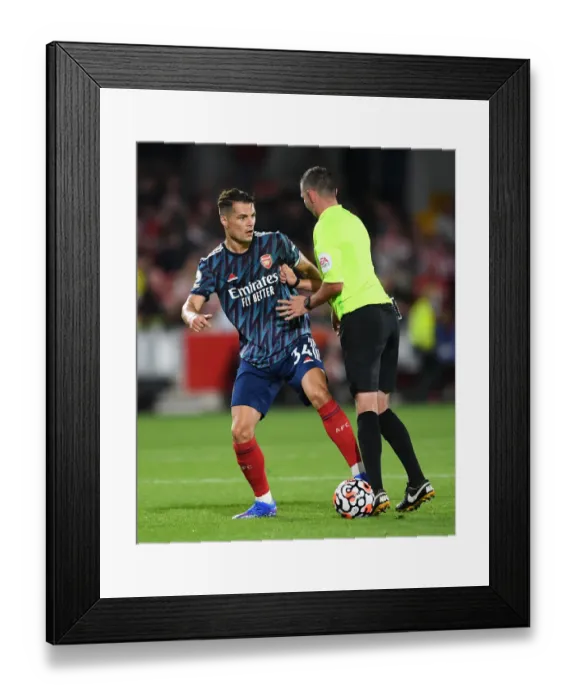 Framed Print : Xhaka vs. Referee: Tense Moment at Brentford vs. Arsenal, 2021-22 Premier League