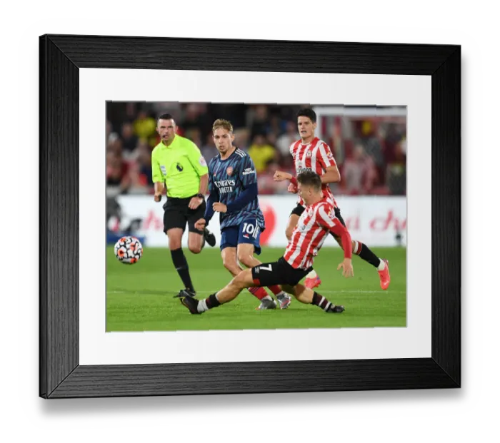 Framed Print : Brentford vs Arsenal: Emile Smith Rowe Faces Off Against Sergi Canos in Premier League Clash