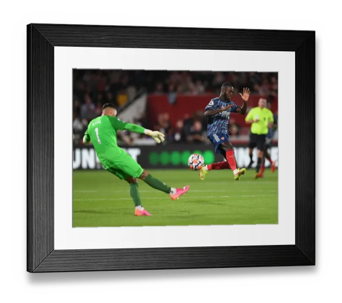 Framed Print : Pepe Closes In: Intense Moment from Brentford vs Arsenal Premier League Clash Framed Print : Pepe Closes In: Intense Moment from Brentford vs Arsenal Premier League Clash