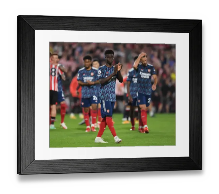Framed Print : Bukayo Saka Celebrates with Arsenal Fans after Brentford Victory - 2021-22 Premier League