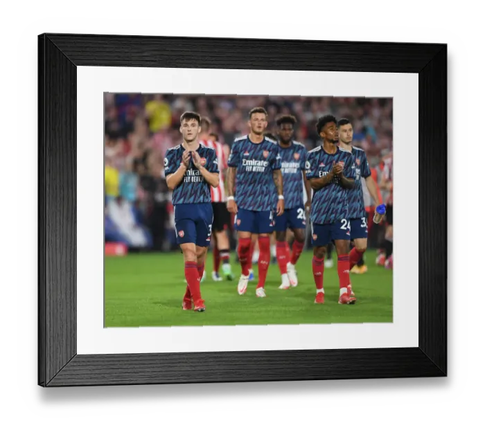 Framed Print : Arsenal's Kieran Tierney Celebrates with Fans after Brentford Victory Framed Print : Arsenal's Kieran Tierney Celebrates with Fans after Brentford Victory