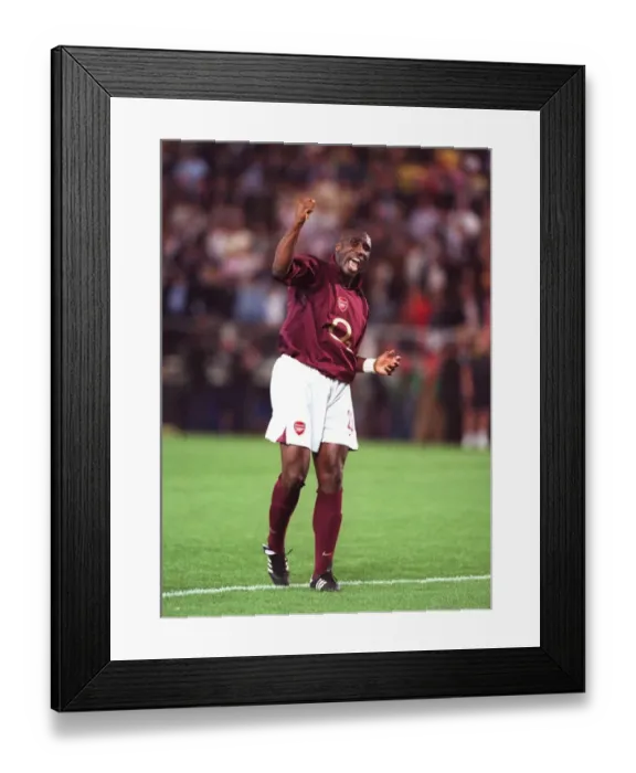 Framed Print : Arsenal's Unforgettable Stalemate: Sol Campbell's Euphoric Celebration vs. Villarreal (UEFA Cup Semifinal) Framed Print : Arsenal's Unforgettable Stalemate: Sol Campbell's Euphoric Celebration vs. Villarreal (UEFA Cup Semifinal)