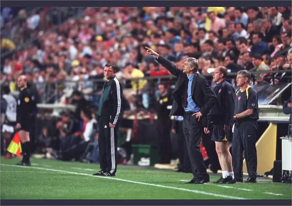 Arsene Wenger the Arsenal Manager gives instructions fromthe touchline
