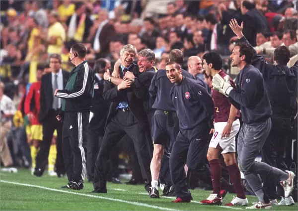 Arsene Wenger the Arsenal Manager celebrates with his Assistant Pat Rice at the final whistle