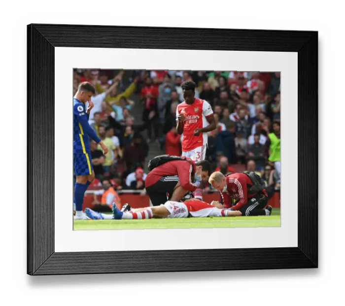 Framed Print : Arsenal: Granit Xhaka Receives Medical Attention vs Chelsea, 2021-22 Premier League Framed Print : Arsenal: Granit Xhaka Receives Medical Attention vs Chelsea, 2021-22 Premier League