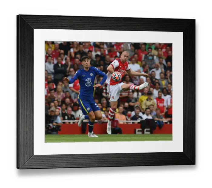 Framed Print : Arsenal vs. Chelsea: Holding Clears Under Pressure in Intense Premier League Clash