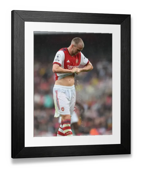 Framed Print : Sweat and Determination: Arsenal's Rob Holding Rings Out Shirt Amidst Intense Arsenal v Chelsea Rivalry (Premier League 2021-22) Framed Print : Sweat and Determination: Arsenal's Rob Holding Rings Out Shirt Amidst Intense Arsenal v Chelsea Rivalry (Premier League 2021-22)