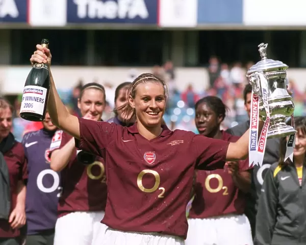 Julie Fleeting lifts the FA Cup Trophy for the Arsenal Ladies