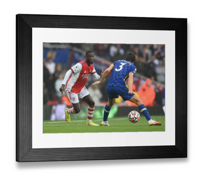 Framed Print : Arsenal vs. Chelsea: Pepe Outmaneuvers Alonso in Premier League Clash Framed Print : Arsenal vs. Chelsea: Pepe Outmaneuvers Alonso in Premier League Clash