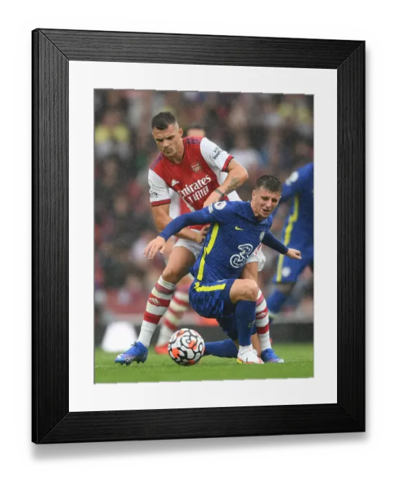 Framed Print : Xhaka vs. Mount: A Battle of Midfield Masters in Arsenal vs. Chelsea, Premier League 2021-22