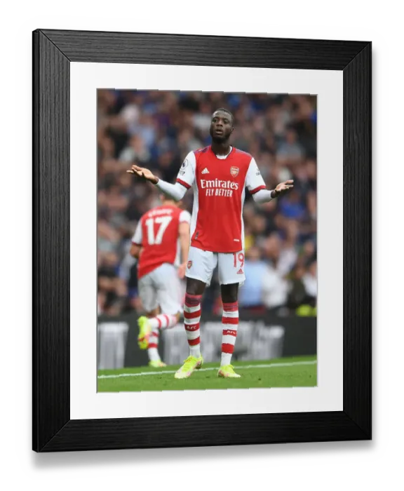 Framed Print : Pepe vs Chelsea: Clash of the Stars - Arsenal's Premier League Kickoff Framed Print : Pepe vs Chelsea: Clash of the Stars - Arsenal's Premier League Kickoff