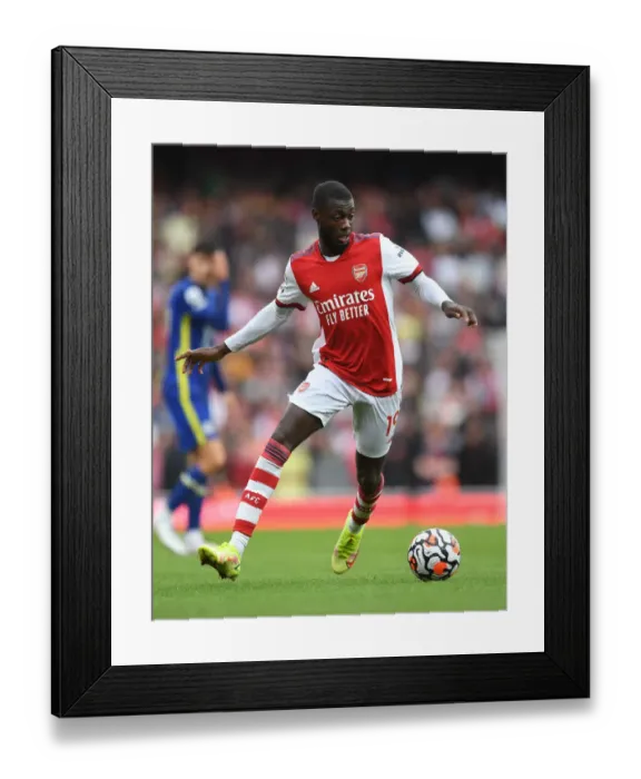 Framed Print : Arsenal's Nicolas Pepe Faces Off Against Chelsea in the 2021-22 Premier League