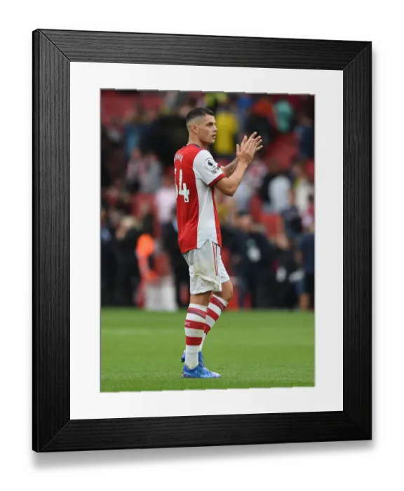 Framed Print : Arsenal's Granit Xhaka Celebrates with Fans after Arsenal vs. Chelsea Victory (2021-22) Framed Print : Arsenal's Granit Xhaka Celebrates with Fans after Arsenal vs. Chelsea Victory (2021-22)