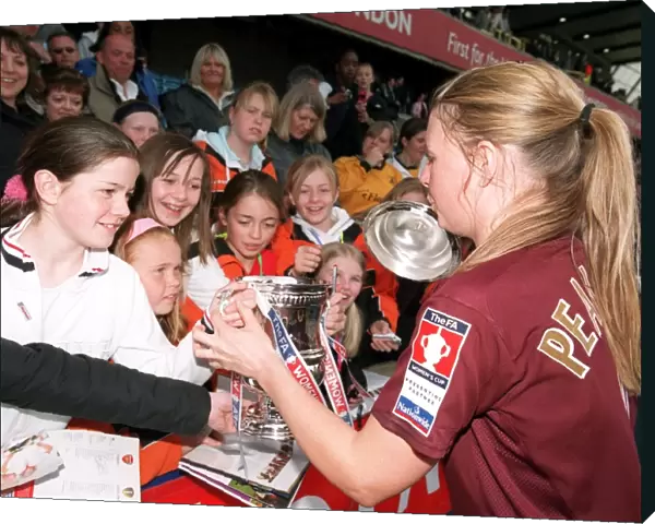 Kirsty Pealling (Arsenal) with the FA Cup Trophy