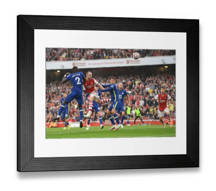 Framed Print : Arsenal's Rob Holding Charges Towards Goal in Arsenal v Chelsea Clash (2021-22)