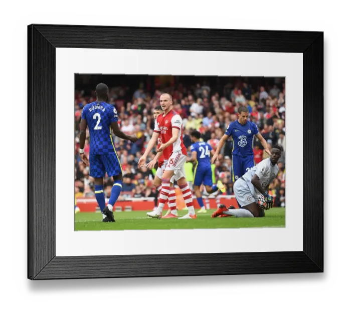 Framed Print : Arsenal vs. Chelsea: Intense Rivalry on the Emirates Field - Holding vs. Rudiger Clash