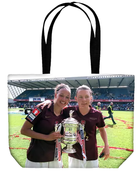 Lianne Sanderson and Kirsty Pealling (Arsenal) with the FA Cup Trophy