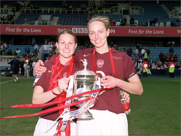 Arsenal Ladies Celebrate FA Cup Victory: Kelly Smith and Faye White Hold the Trophy after 5-0 Win over Leeds United Ladies