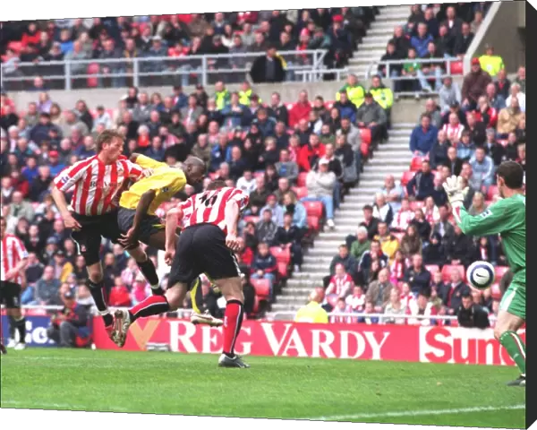 Danny Collins (Sunderland) heads into his own goal under pressure from Abu Diaby for the 1st Arsenal