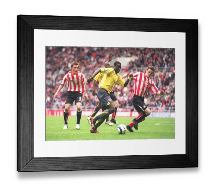 Framed Print : Manu Eboue (Arsenal) George McCartney (Sunderland) Framed Print : Manu Eboue (Arsenal) George McCartney (Sunderland)