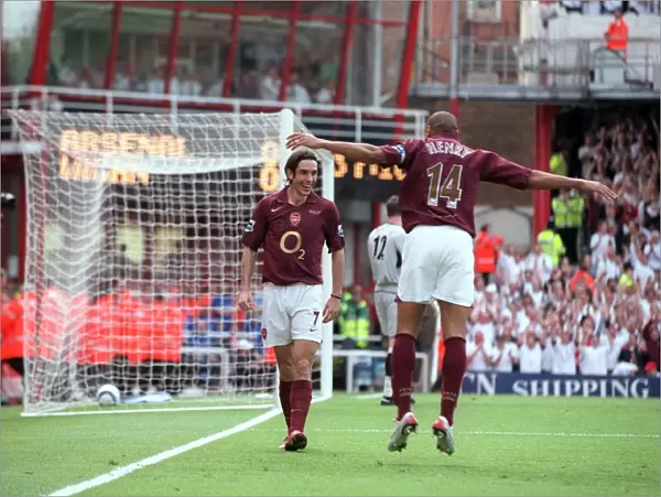 Robert Pires celebrates scoring Arsenal 1st goal with Thierry Henry
