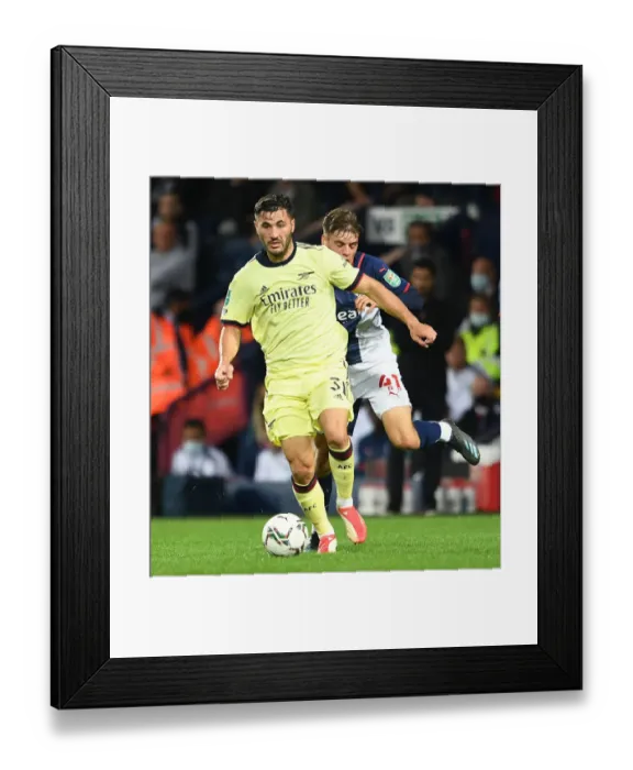 Framed Print : Arsenal's Sead Kolasinac and West Bromwich Albion's Tom Fellows Clash in Intense Carabao Cup Encounter