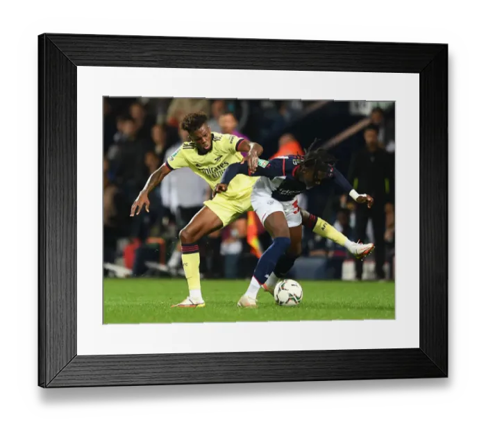 Framed Print : Arsenal vs. West Bromwich Albion: Carabao Cup Clash - Nuno Tavares Faces Off Against Quevin Castro