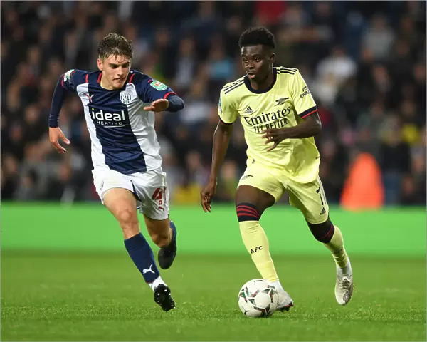 Arsenal's Bukayo Saka Clashes with Tom Fellows in Carabao Cup Battle at West Bromwich Albion