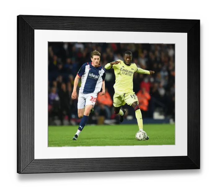 Framed Print : Pepe vs Reach: A Carabao Cup Showdown - Arsenal's Nicolas Pepe Clashes with West Bromwich Albion's Adam Reach