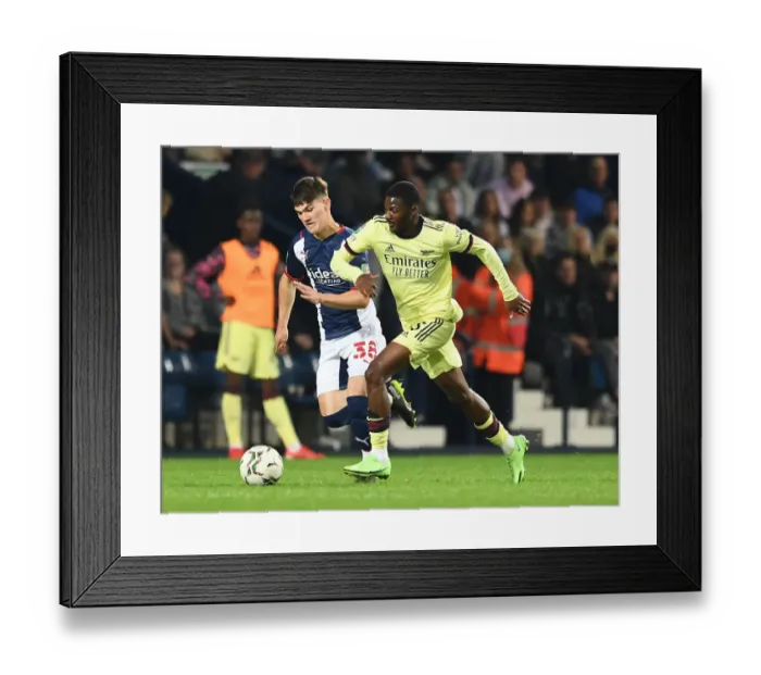 Framed Print : Arsenal's Ainsley Maitland-Niles Faces Off Against West Bromwich Albion's Toby King in Carabao Cup Clash