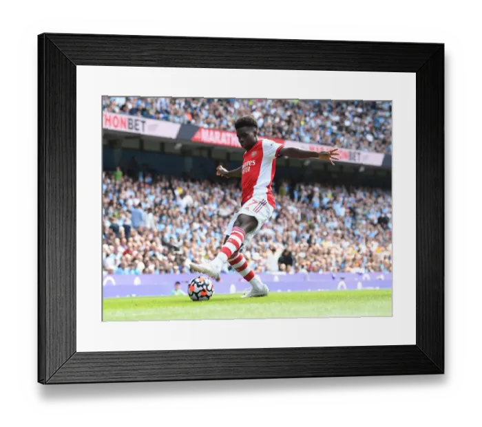 Framed Print : Bukayo Saka Faces Off Against Manchester City: Premier League Clash Framed Print : Bukayo Saka Faces Off Against Manchester City: Premier League Clash