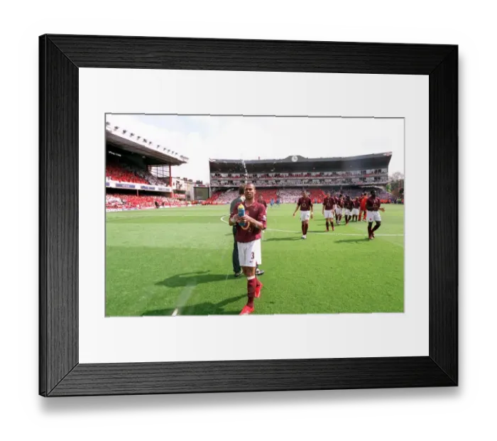 Framed Print : Ashley Cole (Arsenal) squirts water before the match Framed Print : Ashley Cole (Arsenal) squirts water before the match